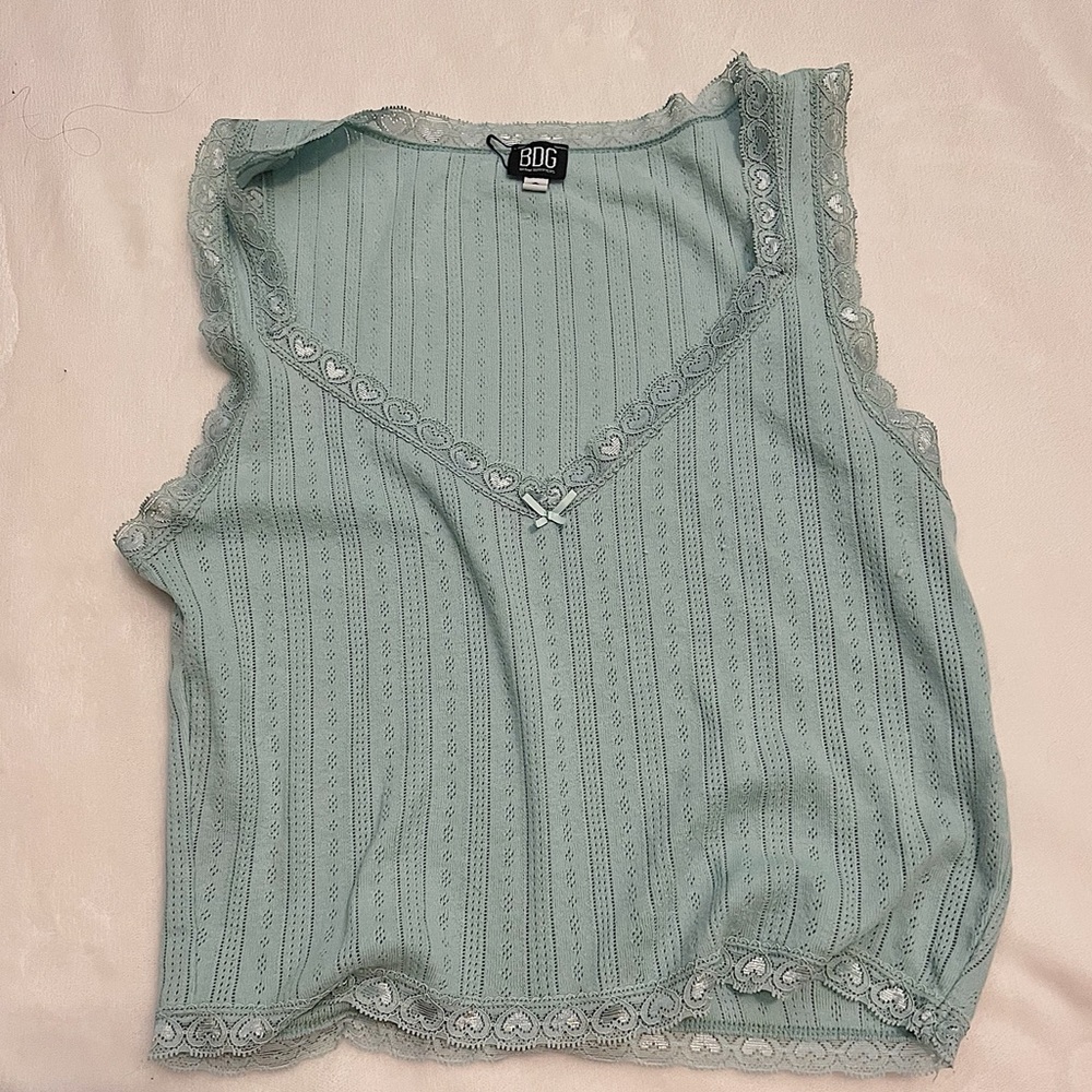 Cute, lightweight, and lacy tank top. Perfect for hot summer days.